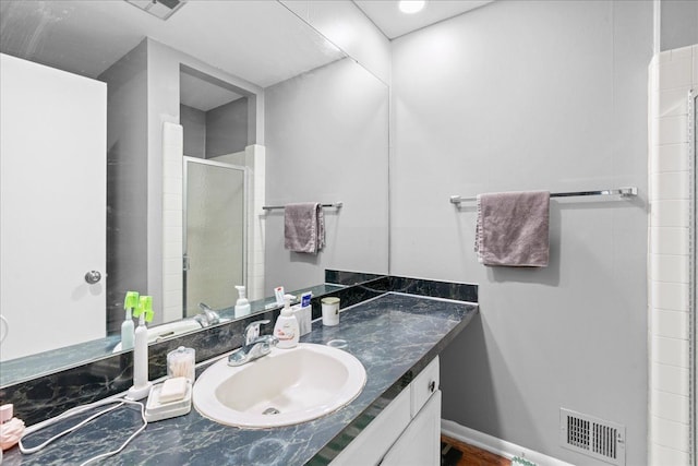3715 W Hiawatha Dr, Okemos, MI 48864 - bathroom with a shower stall, vanity, and visible vents