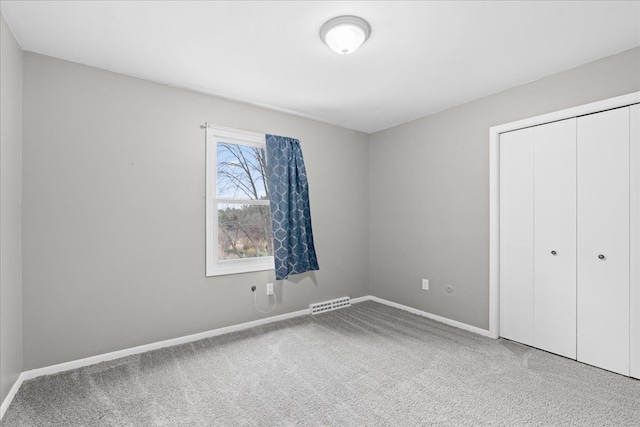 3715 W Hiawatha Dr, Okemos, MI 48864 - unfurnished bedroom with visible vents, baseboards, and carpet floors