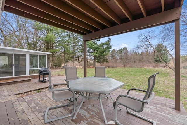 3715 W Hiawatha Dr, Okemos, MI 48864 - wooden terrace featuring a yard, outdoor dining area, a sunroom, and area for grilling