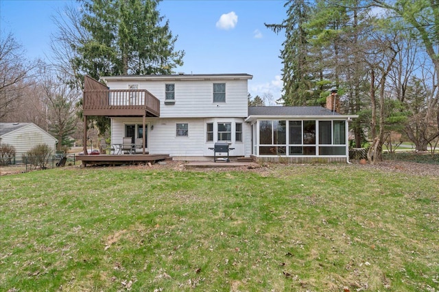 3715 W Hiawatha Dr, Okemos, MI 48864 - rear view of house featuring a sunroom, a lawn, a chimney, fence, and a wooden deck