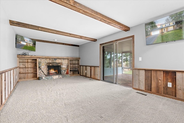 3715 W Hiawatha Dr, Okemos, MI 48864 - unfurnished living room featuring visible vents, beamed ceiling, wainscoting, and carpet floors