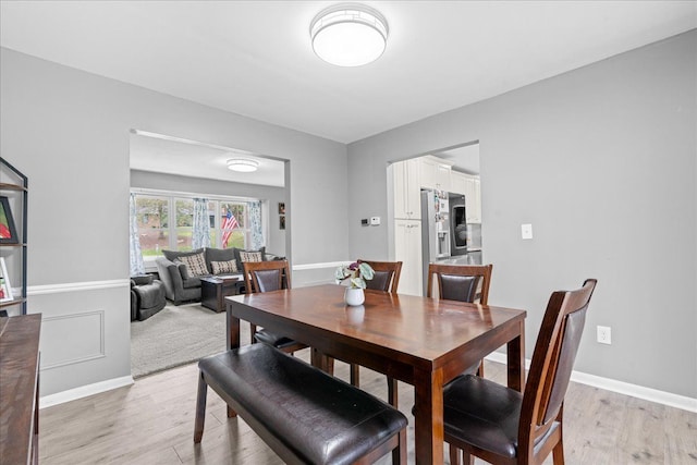 3715 W Hiawatha Dr, Okemos, MI 48864 - dining space with light wood-type flooring