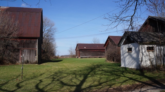 11340 Mccrone Rd, Milan, MI 48160 - view of grassy yard featuring a barn and an outdoor structure