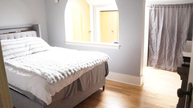 11340 Mccrone Rd, Milan, MI 48160 - bedroom featuring wood finished floors and baseboards