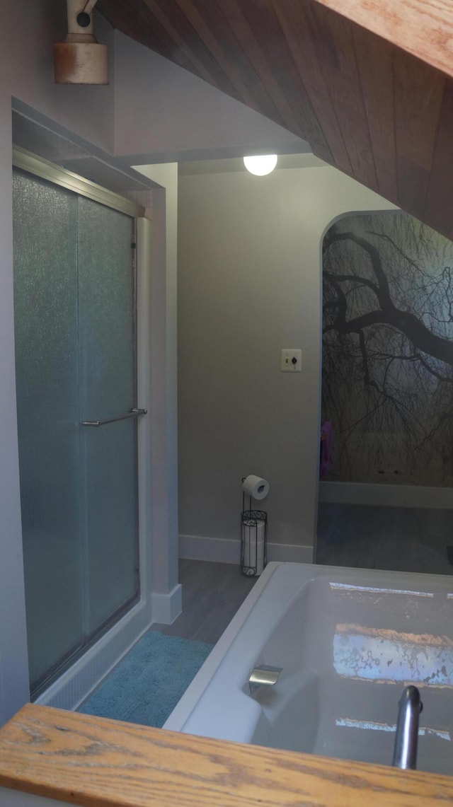 11340 Mccrone Rd, Milan, MI 48160 - bathroom featuring lofted ceiling and a stall shower