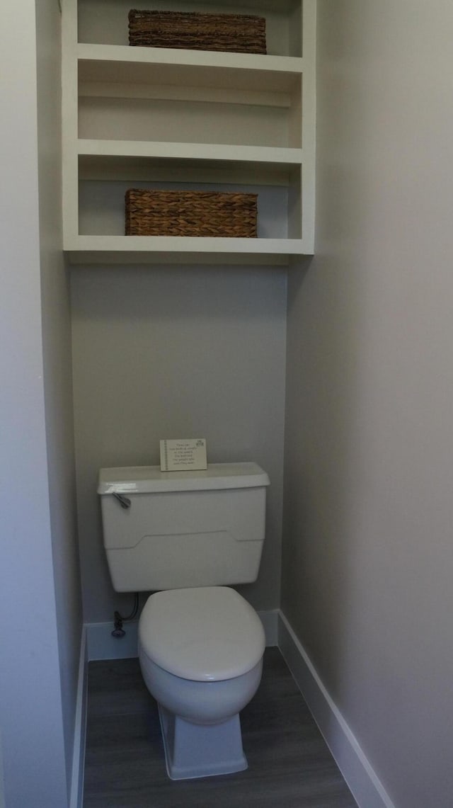 11340 Mccrone Rd, Milan, MI 48160 - bathroom featuring baseboards, wood finished floors, and toilet