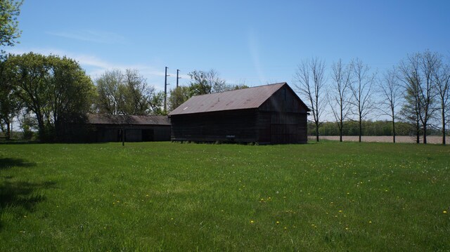 11340 Mccrone Rd, Milan, MI 48160 - view of grassy yard featuring an outbuilding
