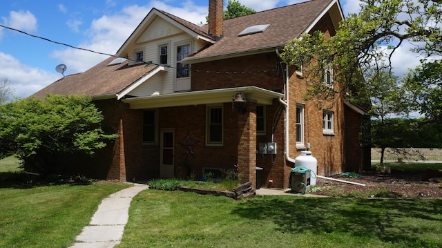 11340 Mccrone Rd, Milan, MI 48160 - view of front of home featuring brick siding, a chimney, and a front yard