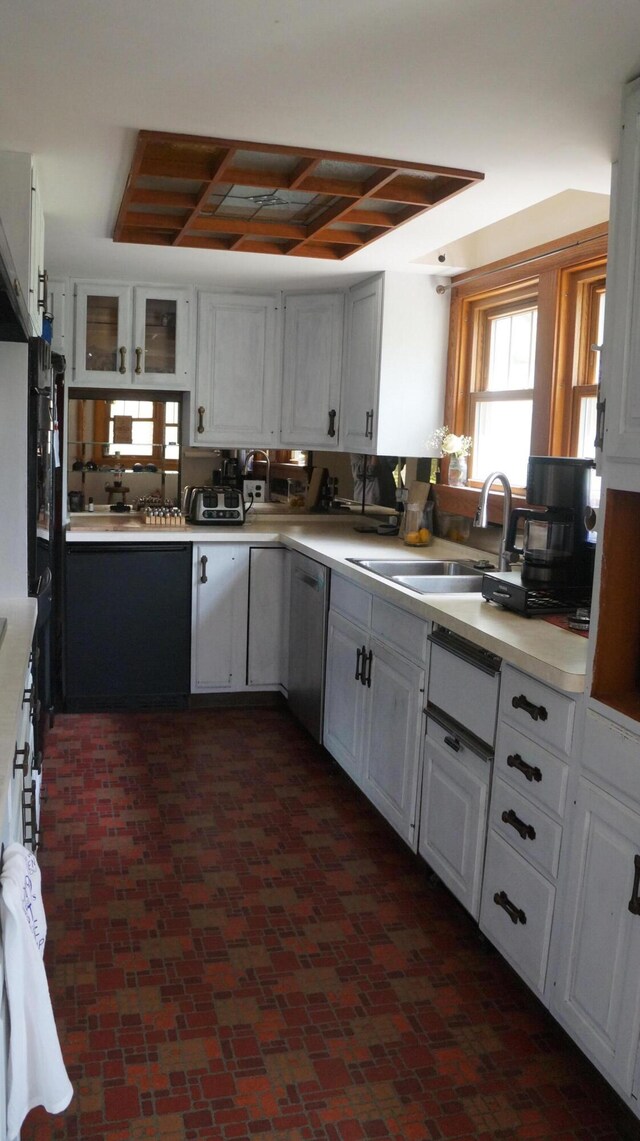11340 Mccrone Rd, Milan, MI 48160 - kitchen with a sink, dishwasher, plenty of natural light, and white cabinets