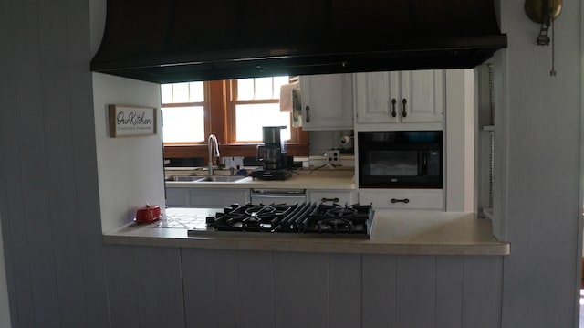 11340 Mccrone Rd, Milan, MI 48160 - kitchen with a sink, gas stovetop, white cabinets, black microwave, and light countertops