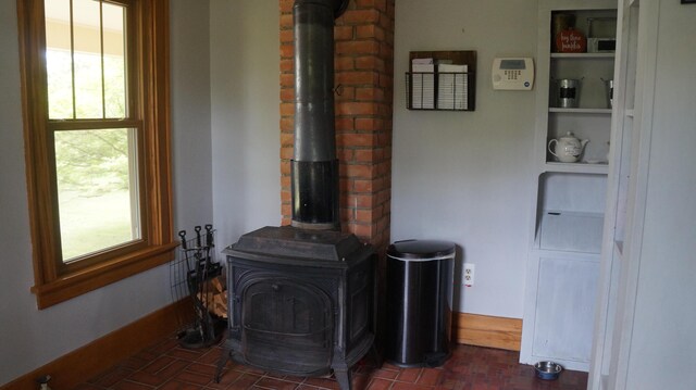 11340 Mccrone Rd, Milan, MI 48160 - detailed view of a wood stove and baseboards