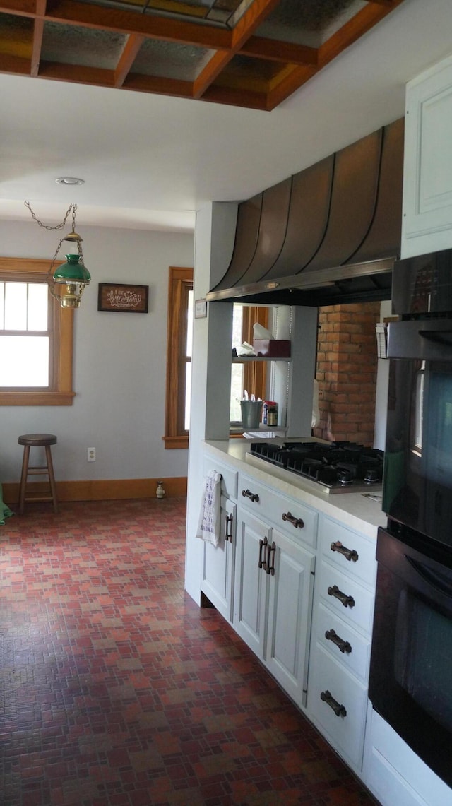 11340 Mccrone Rd, Milan, MI 48160 - kitchen with gas stovetop, baseboards, light countertops, and white cabinetry