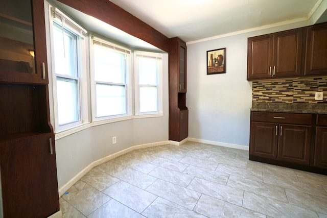 3638 Katherine St, Dearborn, MI 48124 - unfurnished dining area featuring crown molding and baseboards