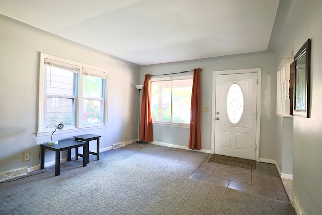 3638 Katherine St, Dearborn, MI 48124 - carpeted entrance foyer featuring tile patterned floors, baseboards, and visible vents