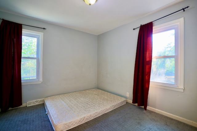 3638 Katherine St, Dearborn, MI 48124 - unfurnished bedroom with visible vents, multiple windows, and carpet