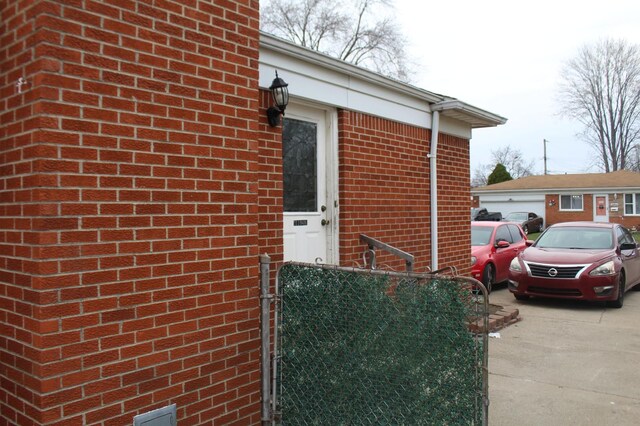 property entrance with brick siding