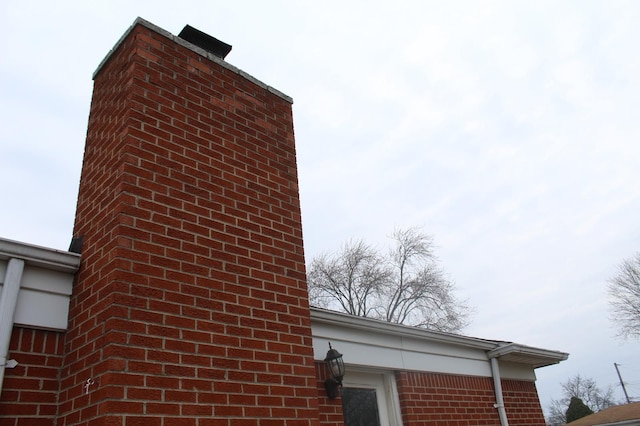 view of side of home featuring brick siding