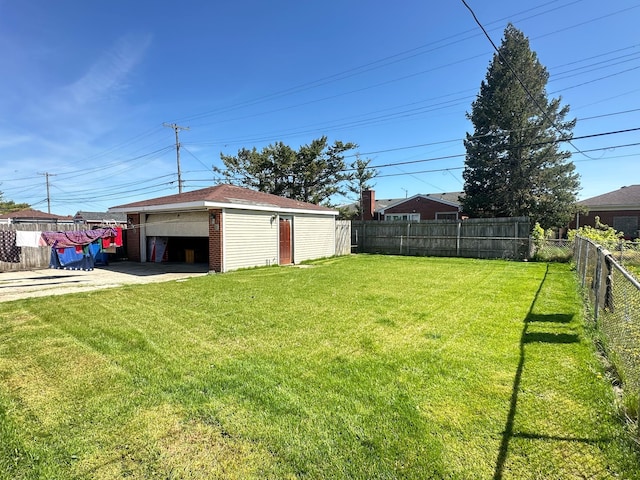 view of yard with a garage and an outdoor structure