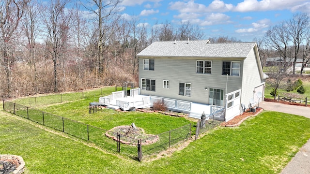 2515 N Lake Pleasant Rd, Attica, MI 48412 - rear view of house featuring a wooden deck, a shingled roof, and driveway