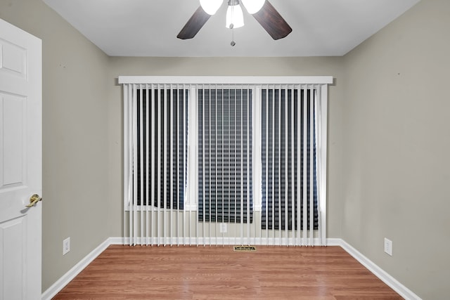 2515 N Lake Pleasant Rd, Attica, MI 48412 - unfurnished room featuring a ceiling fan, wood finished floors, and baseboards