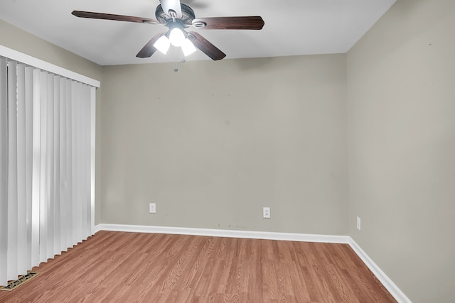 2515 N Lake Pleasant Rd, Attica, MI 48412 - empty room featuring light wood-type flooring, ceiling fan, and baseboards