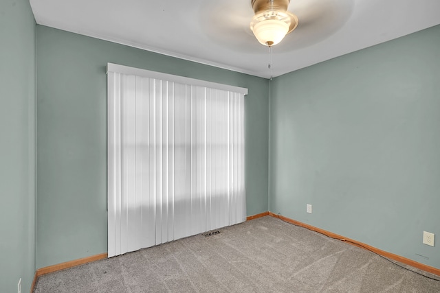 2515 N Lake Pleasant Rd, Attica, MI 48412 - carpeted spare room with baseboards and a ceiling fan