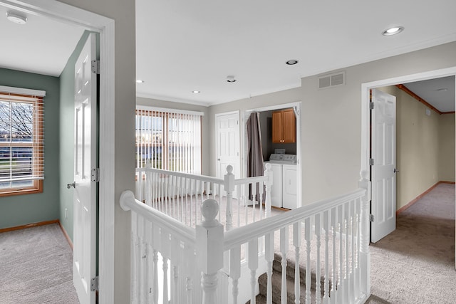 2515 N Lake Pleasant Rd, Attica, MI 48412 - corridor featuring light carpet, an upstairs landing, separate washer and dryer, healthy amount of natural light, and recessed lighting