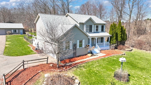 2515 N Lake Pleasant Rd, Attica, MI 48412 - traditional-style home featuring a porch and a shingled roof