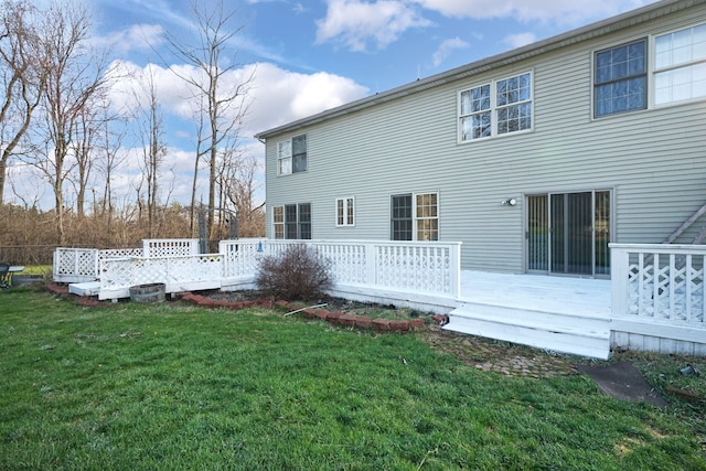 2515 N Lake Pleasant Rd, Attica, MI 48412 - rear view of house with a wooden deck and a yard