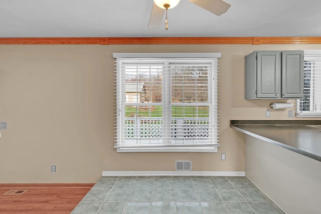 2515 N Lake Pleasant Rd, Attica, MI 48412 - unfurnished dining area with healthy amount of natural light, ceiling fan, and baseboards