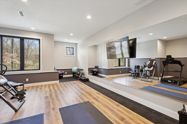 workout area with visible vents, recessed lighting, wood finished floors, and baseboards
