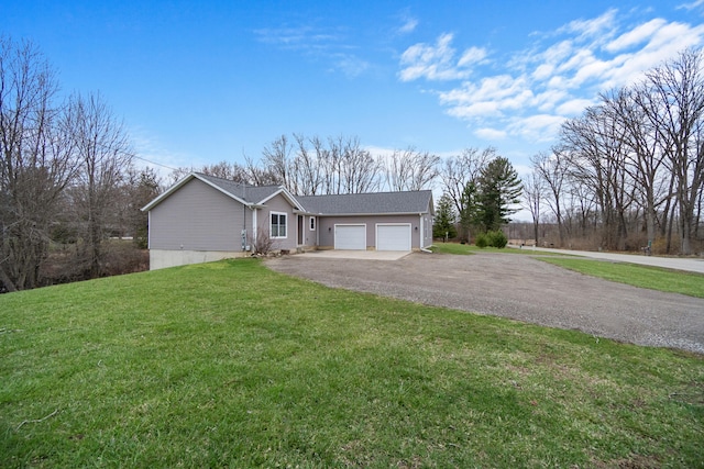 ranch-style house with driveway, a garage, and a front lawn