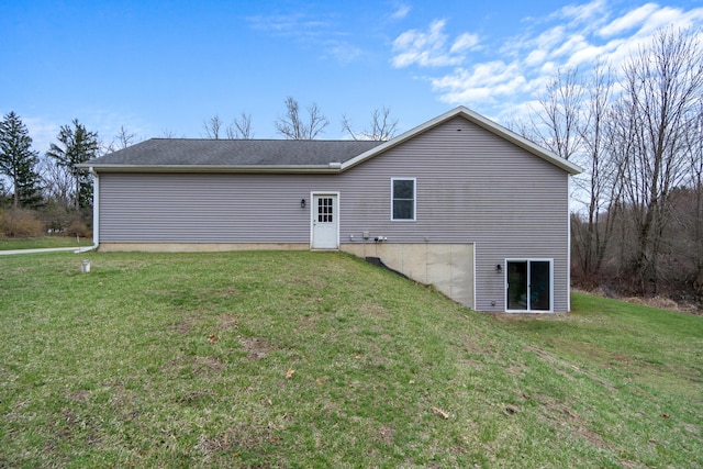 rear view of house with a lawn