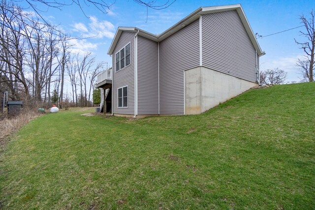 view of home's exterior featuring a yard