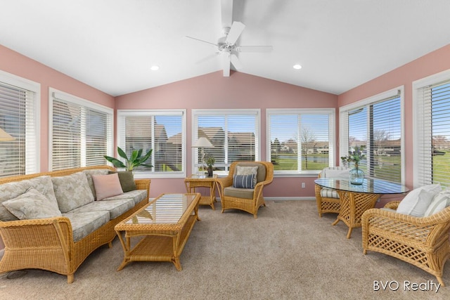 sunroom / solarium featuring baseboards, carpet flooring, lofted ceiling with beams, and a healthy amount of sunlight