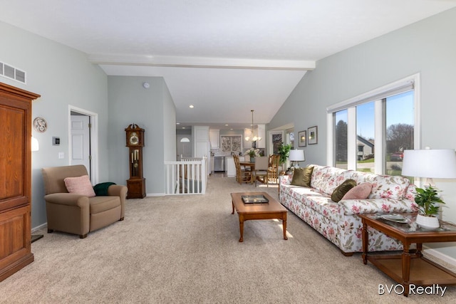 living area featuring visible vents, vaulted ceiling with beams, and light carpet