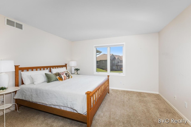 bedroom with visible vents, baseboards, and carpet floors