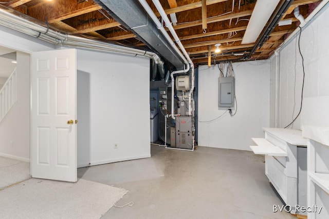 unfinished basement featuring stairway, heating unit, and electric panel