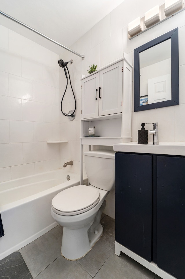 bathroom featuring vanity, tile patterned floors, bathing tub / shower combination, and toilet