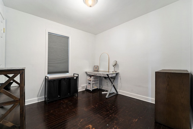 unfurnished room with baseboards and hardwood / wood-style floors