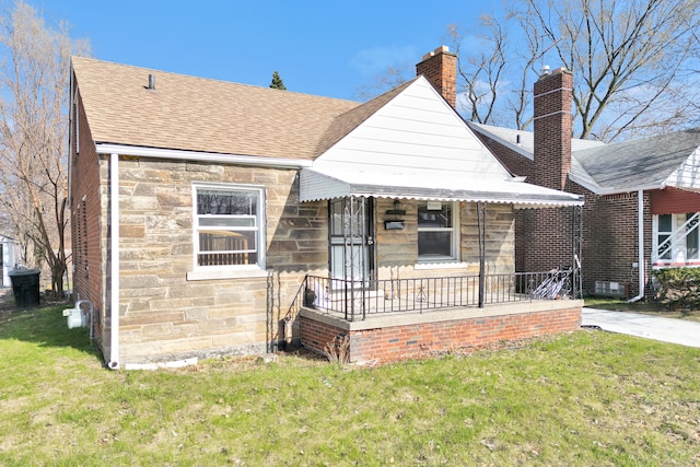 19544 Strasburg St, Detroit, MI 48205 - bungalow-style house with roof with shingles, a porch, stone siding, and a front lawn