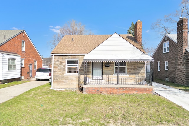19544 Strasburg St, Detroit, MI 48205 - bungalow-style home with covered porch, a shingled roof, stone siding, and a front lawn