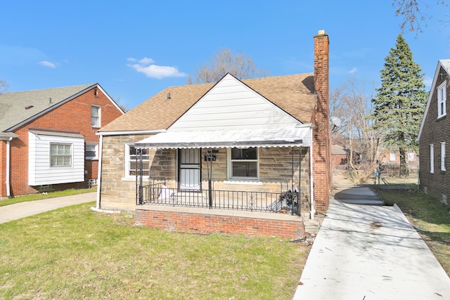 19544 Strasburg St, Detroit, MI 48205 - bungalow-style home with a front yard, a shingled roof, a porch, stone siding, and a chimney
