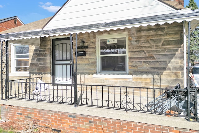 19544 Strasburg St, Detroit, MI 48205 - entrance to property with stone siding and roof with shingles