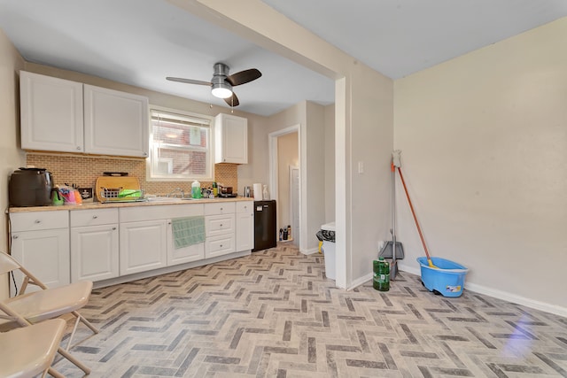 19544 Strasburg St, Detroit, MI 48205 - kitchen with tasteful backsplash, baseboards, light countertops, white cabinets, and a sink