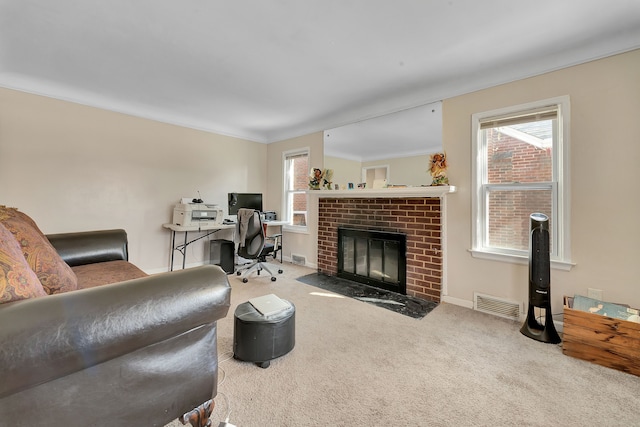 19544 Strasburg St, Detroit, MI 48205 - home office with a brick fireplace, carpet, visible vents, and a wealth of natural light
