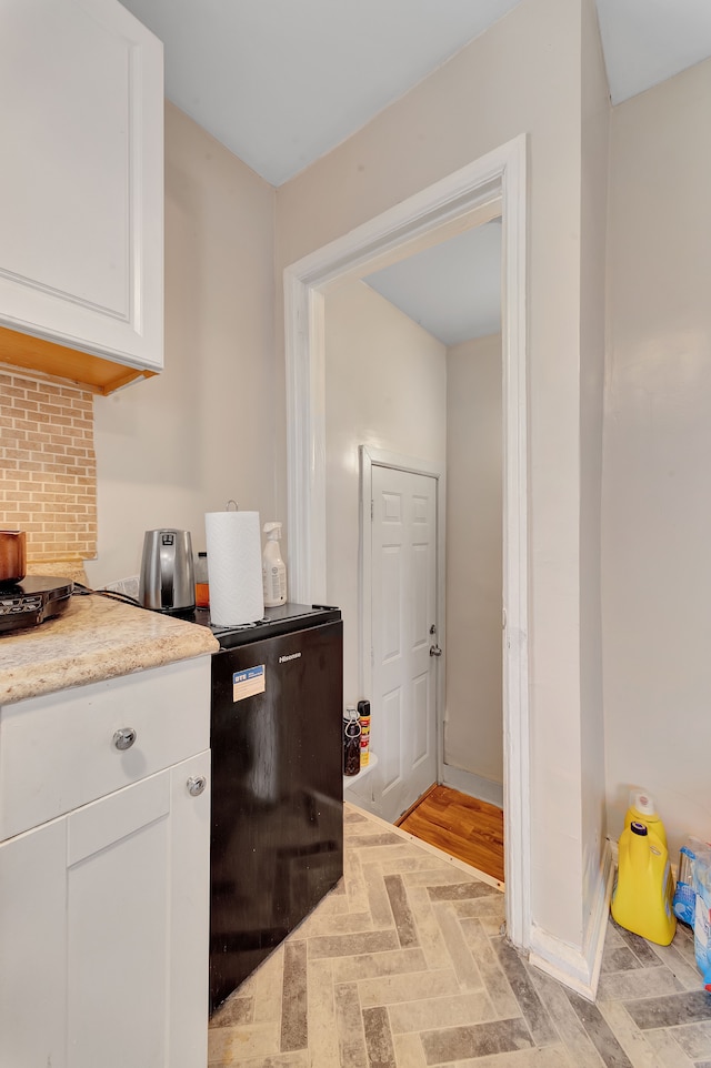 19544 Strasburg St, Detroit, MI 48205 - kitchen with light countertops, white cabinetry, and baseboards