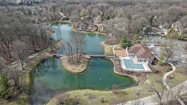 aerial view with a water view and a view of trees