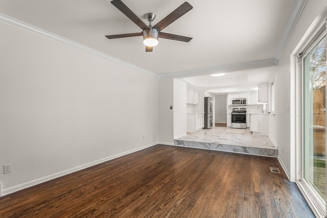 unfurnished living room featuring baseboards, crown molding, a ceiling fan, and wood finished floors