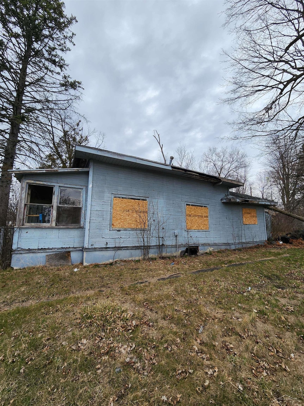 view of home's exterior with a lawn